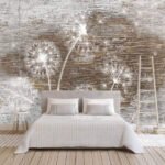 Papier peint – Pissenlits blancs sur mur de briques