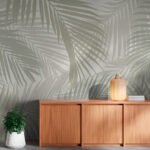 Papier peint – Palmes blanches sur fond vert grisé