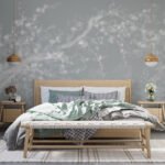 Papier peint – Branches blanches sur fond bleu grisé