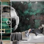 Papier peint – Ballon de football noir et blanc sur fond vert